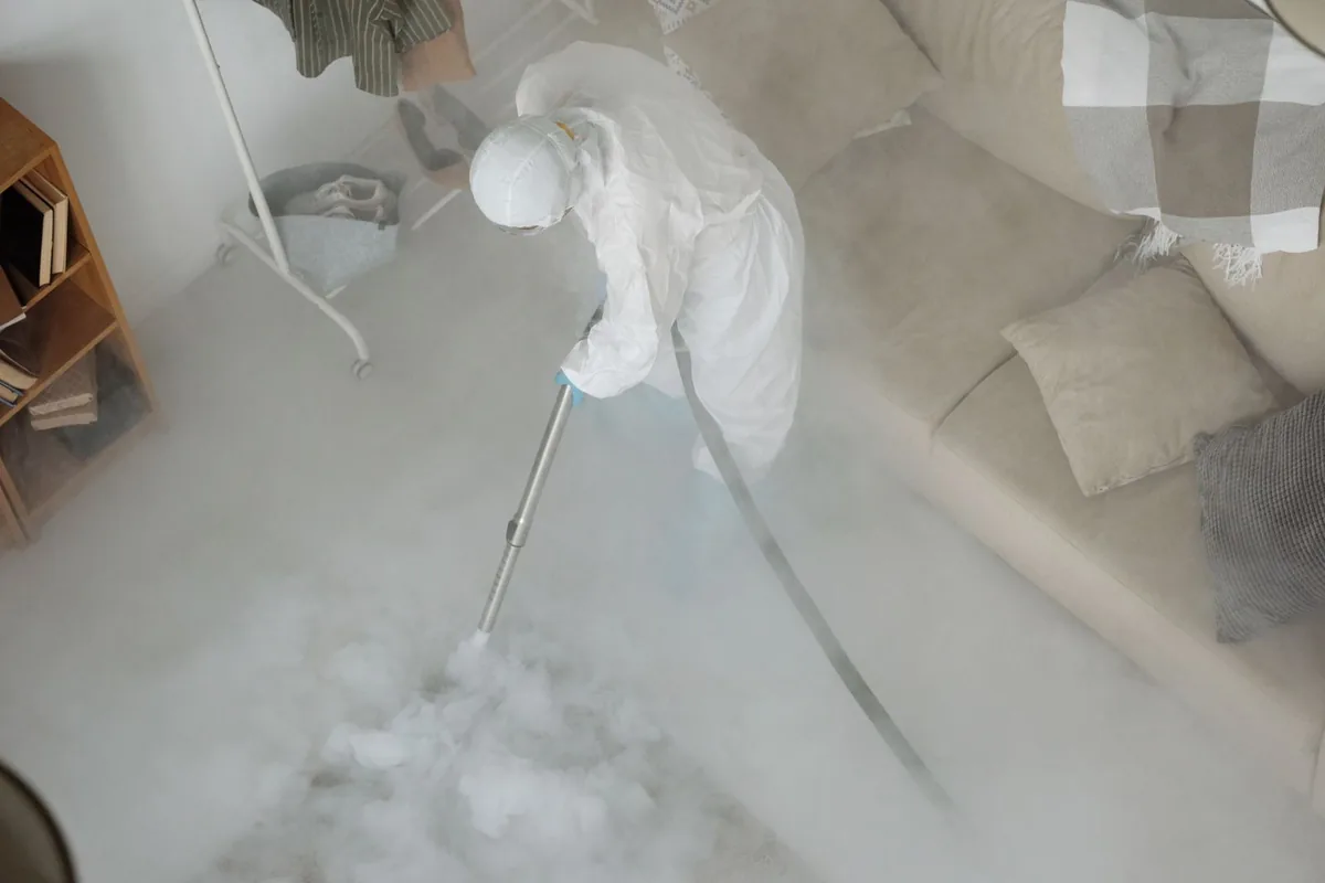 Biohazard cleanup technician in protective equipment, Argo, AL